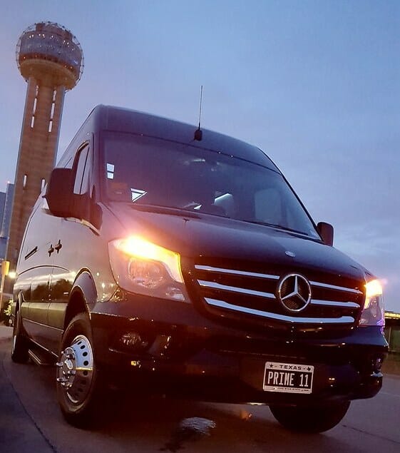 Front of black Sprinter with Dallas Reunion Tower in background
